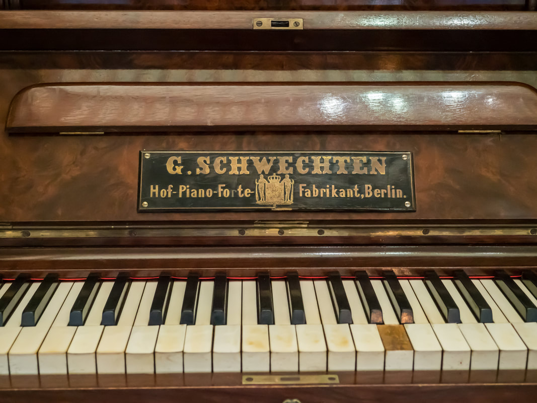 Vintage piano. Yellowed and broken piano keys. G Schwechten. Coolart Homestead, Mornington Peninsula, Australia.