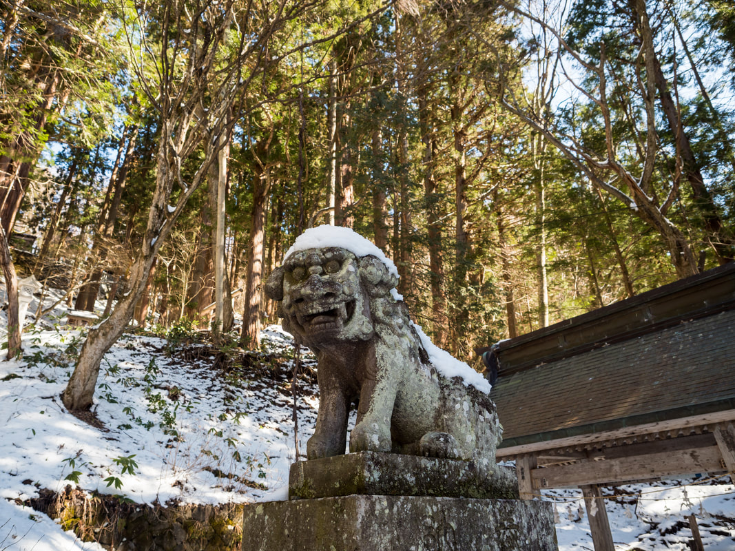 The statue at the base of the stairs to the Lower Togakushi Shrine.