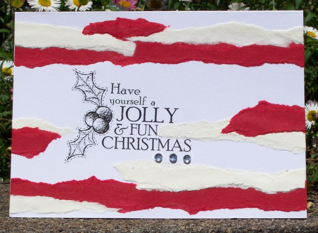 Make Christmas cards using rub on embellishments and torn paper strips