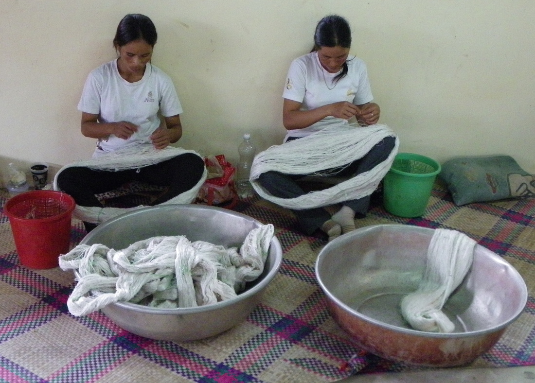 Angkor Silk Farm, Siem Reap, Cambodia, sorting through the raw silk