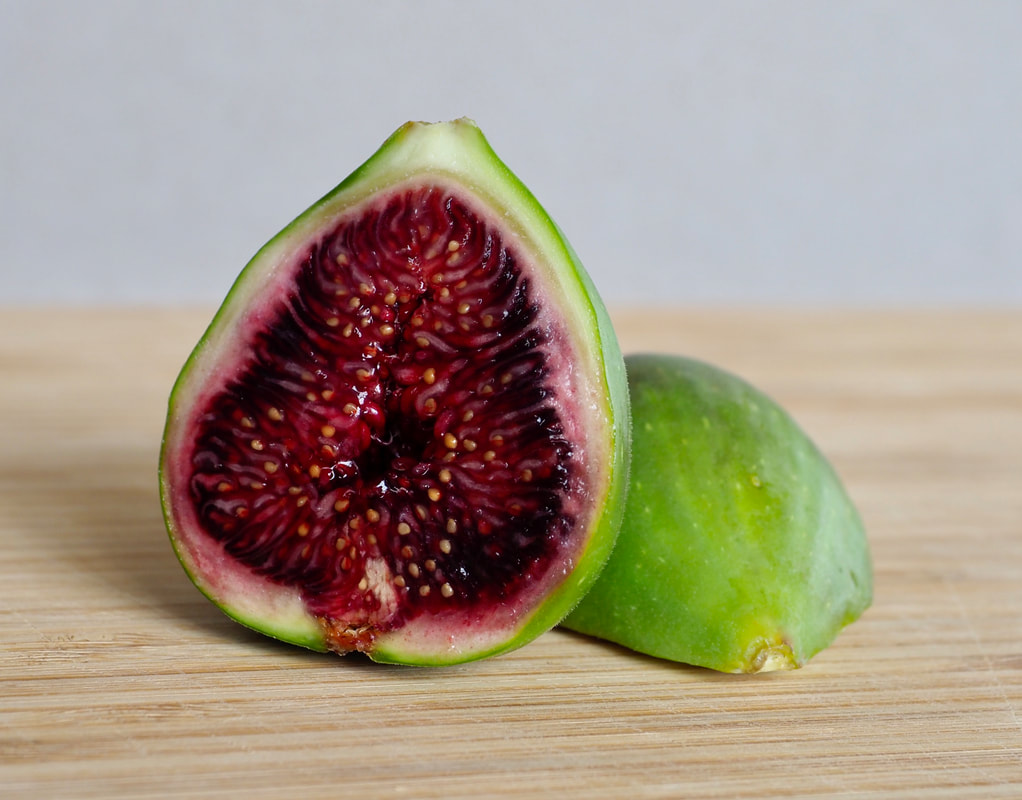 Ripe fig fruit halved. 