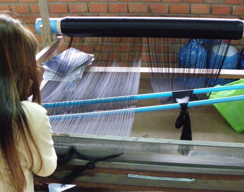 setting up a weaving loom angkor silk farm siem reap cambodia