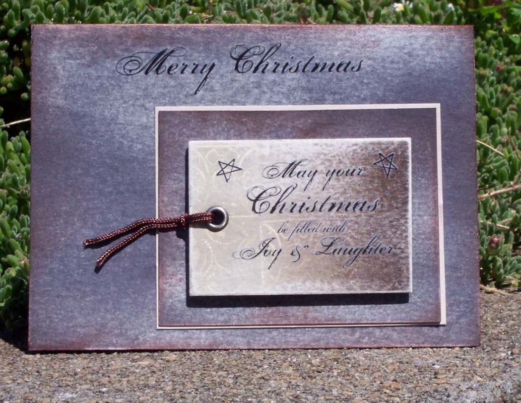 Make Christmas cards using recycled jeans tags and rub on embellishments