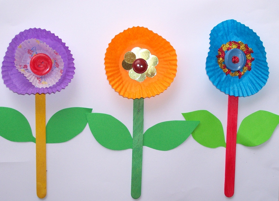 Free craft idea for children row of flowers using patty pans, pop sticks, buttons and more