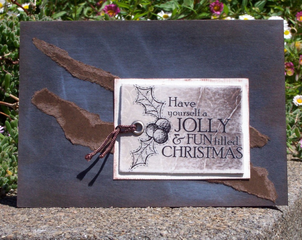 Make Christmas cards using recycled jeans tags and rub on embellishments