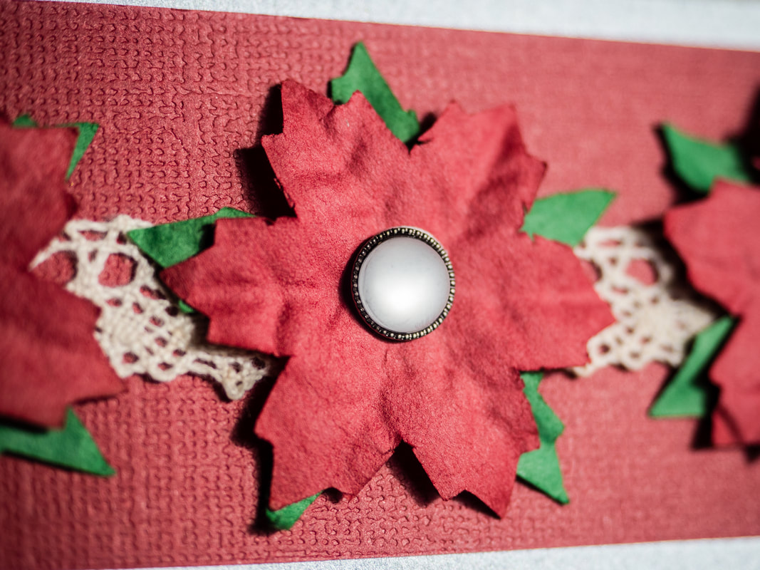 Celebrate Christmas hand made card idea with paper poinsettias and lace ribbon