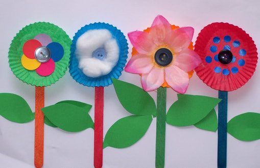 Free craft idea for children row of flowers using patty pans, pop sticks, buttons and more